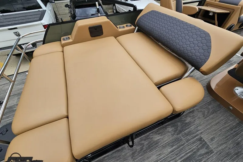 Slide: The Image of Luxurious seating on 2026 Landau Signature 25C pontoon boat, featuring tan and gray upholstery. - 44
