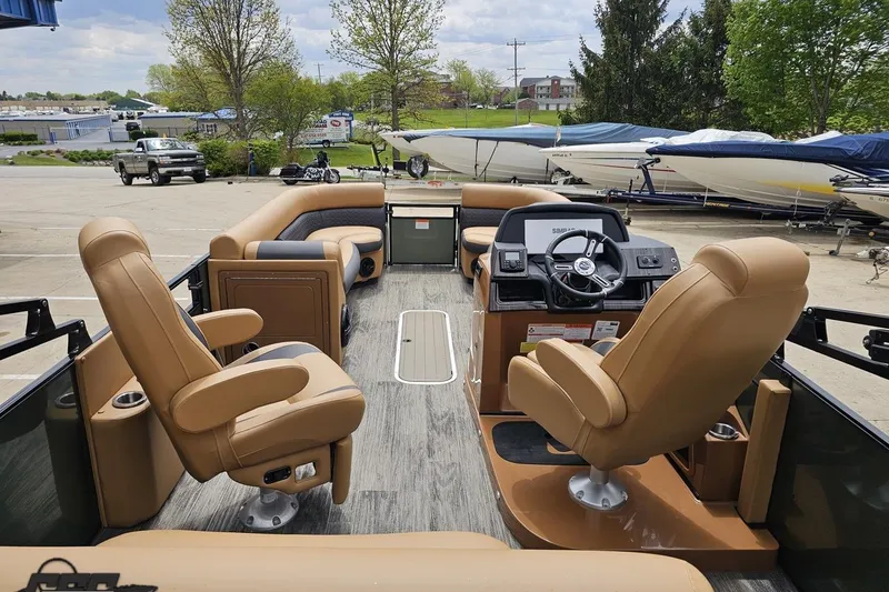 Slide: The Image of 2026 Landau Signature 25C pontoon boat interior with luxurious seating and modern dashboard. - 46