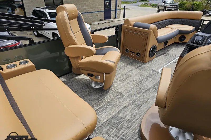 Slide: The Image of Luxurious interior of 2026 Landau Signature 25C pontoon boat with tan seating. - 48