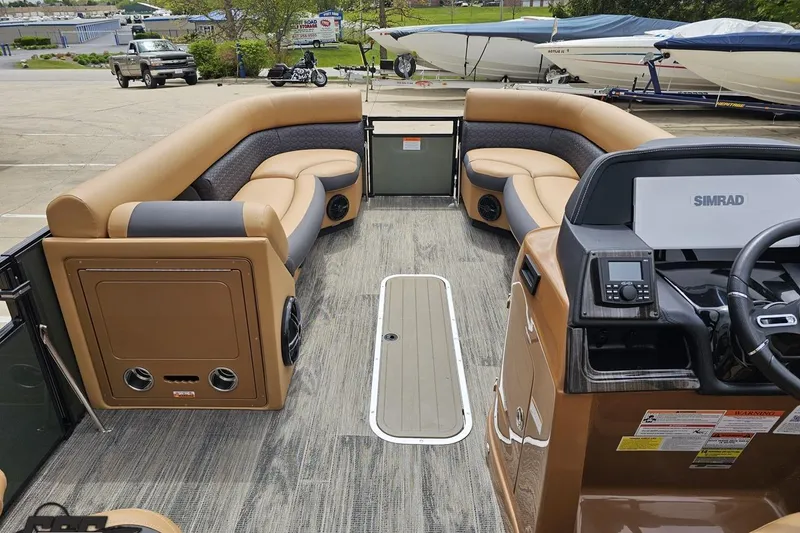 Slide: The Image of 2026 Landau Signature 25C pontoon boat interior with luxurious seating and modern dashboard. - 50