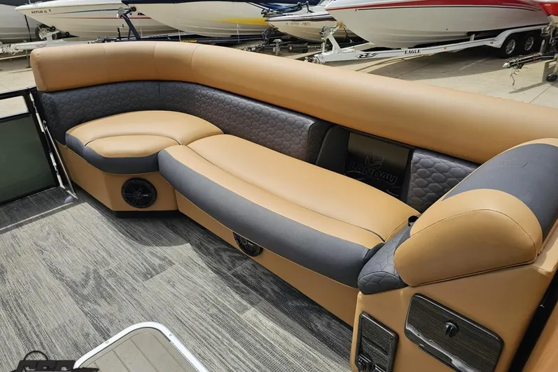 Slide: The Image of Luxurious seating on 2026 Landau Signature 25C pontoon boat with tan and gray upholstery. - 62