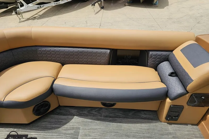 Slide: The Image of Luxurious seating on 2026 Landau Signature 25C pontoon boat, featuring tan and gray upholstery. - 63