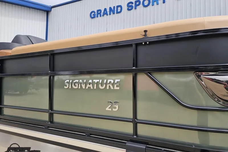 Slide: The Image of 2026 Landau Signature 25C boat exterior at Grand Sport dealership. - 7
