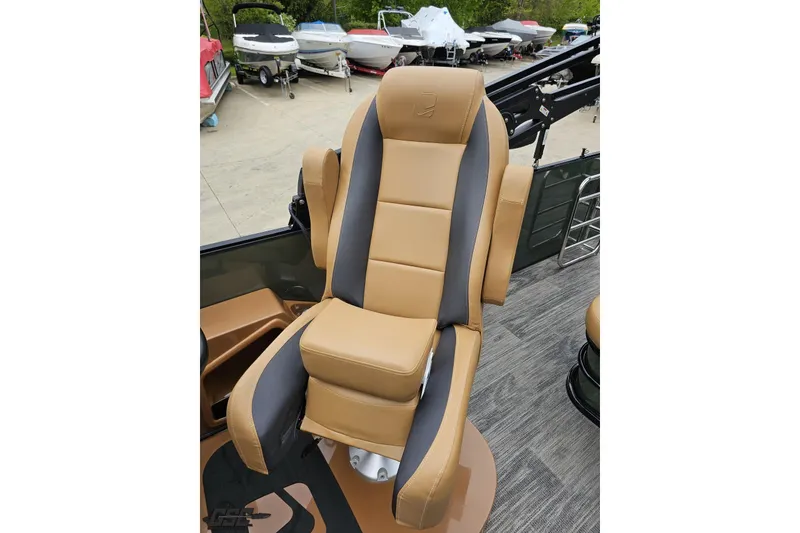 Slide: The Image of Captain's chair on 2026 Landau Signature 25C boat, featuring tan and gray upholstery. - 71