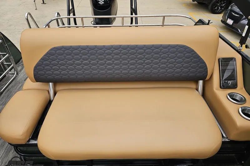 Slide: The Image of 2026 Landau Signature 25C boat seat with tan and gray upholstery, cup holders, and railing. - 73
