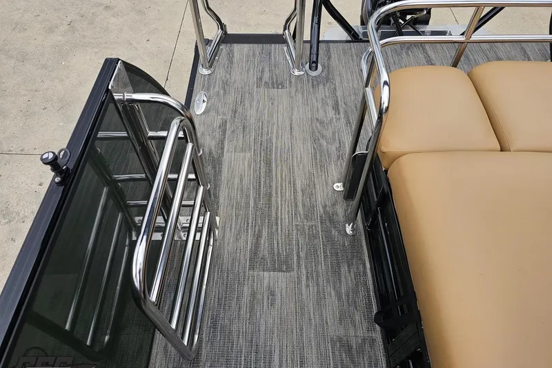 Slide: The Image of Interior view of 2026 Landau Signature 25C pontoon boat with sleek flooring and cushioned seating. - 74