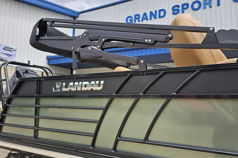 Slide: The Image of 2026 Landau Signature 25C boat at Grand Sport Center, featuring sleek design and branding. - 8