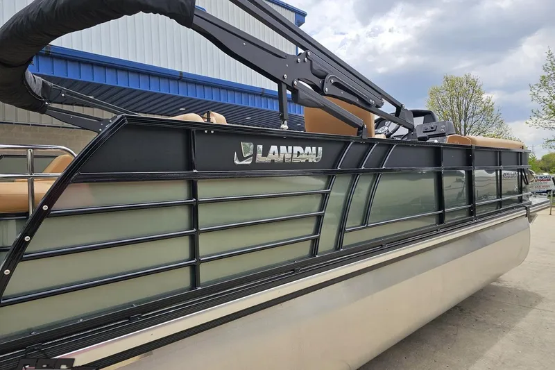 Slide: The Image of 2026 Landau Signature 25C pontoon boat with sleek design and modern features. - 9
