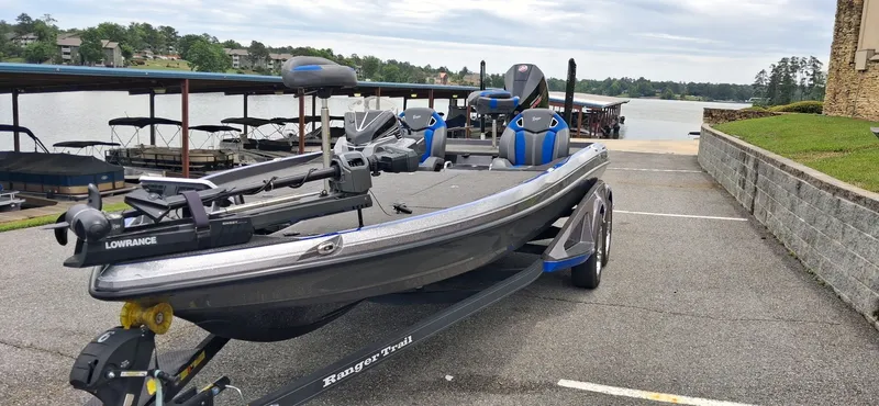 Slide: The Image of 2024 Ranger Z521R boat parked by the lakeside. - 11