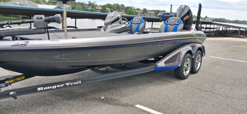 Slide: The Image of 2024 Ranger Z521R boat parked on trailer by lakeside. - 12