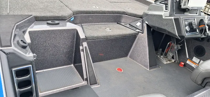 Slide: The Image of Interior of 2024 Ranger Z521R with console and storage area. - 16