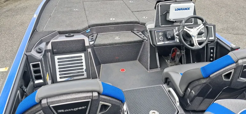 Slide: The Image of Interior of 2024 Ranger Z521R with steering console and blue seats. - 6