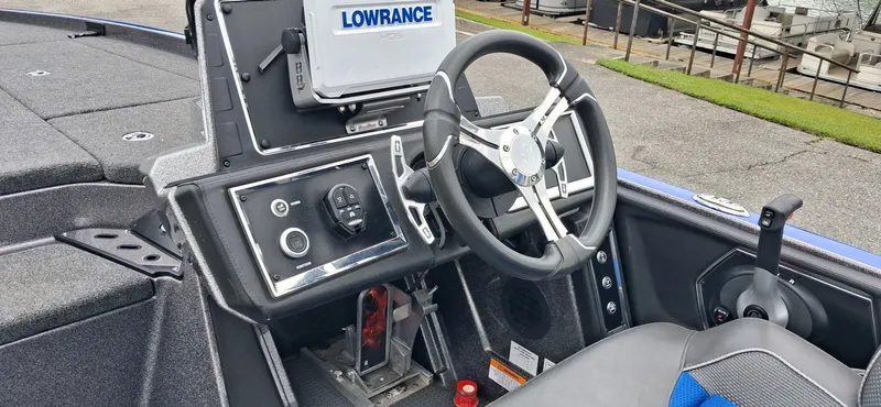 Slide: The Image of Interior view of 2024 Ranger Z521R boat with steering wheel and controls. - 7