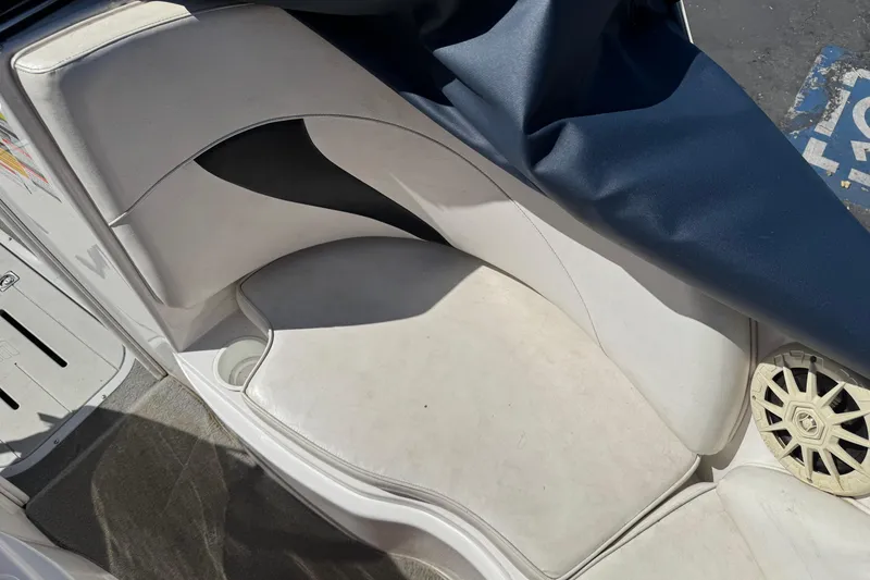 Slide: The Image of Interior seating of a 2006 Ebbtide 190 SE boat with white upholstery. - 20