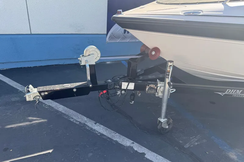 Slide: The Image of 2006 Ebbtide 190 SE boat on trailer, parked in a lot. - 3