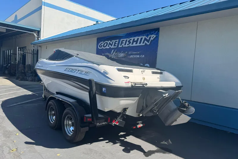 Slide: The Image of 2006 Ebbtide 190 SE boat on trailer outside a marine shop. - 7