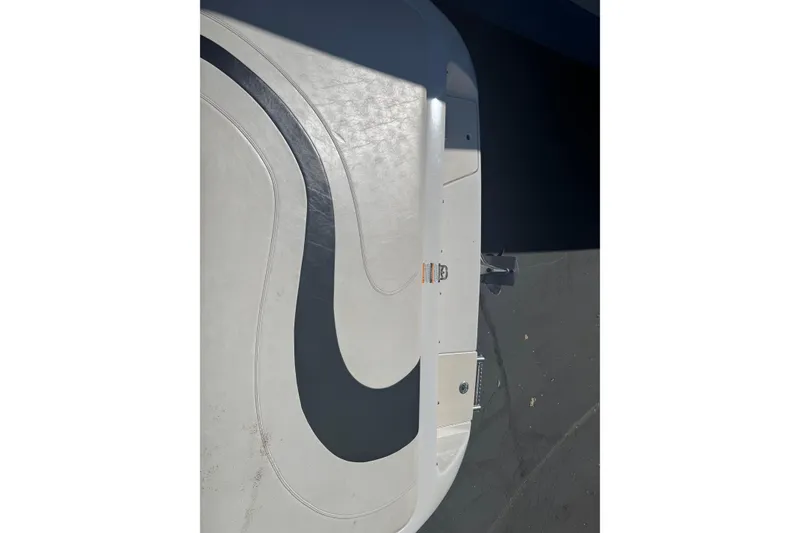Slide: The Image of 2006 Ebbtide 190 SE boat deck with sleek black and white design. - 8