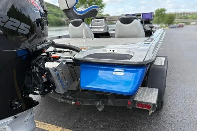 Slide: The Image of 2021 Caymas CX 19 boat with powerful engine, parked near a scenic river. - 13