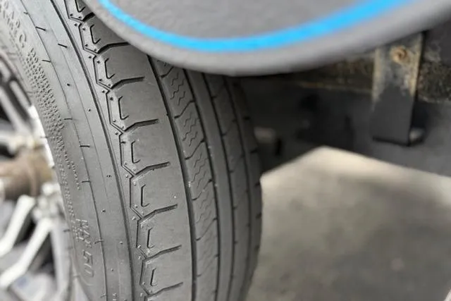 Slide: The Image of Close-up of a 2021 Caymas CX 19 tire with detailed tread pattern. - 22