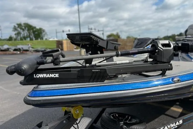 Slide: The Image of 2021 Caymas CX 19 boat with Lowrance Ghost trolling motor, parked outdoors. - 29