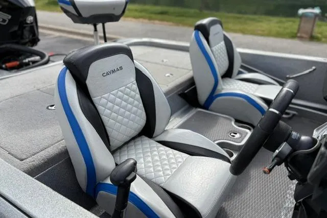 Slide: The Image of 2021 Caymas CX 19 boat interior with stylish seats and steering wheel. - 33