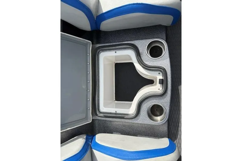 Slide: The Image of 2021 Caymas CX 19 boat interior with storage compartment and cup holders. - 44