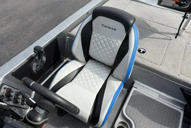 Slide: The Image of 2021 Caymas CX 19 boat seat with quilted design and steering controls. - 45