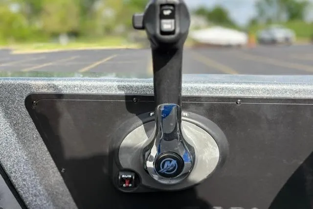 Slide: The Image of Throttle control of a 2021 Caymas CX 19 boat, featuring a sleek design. - 48
