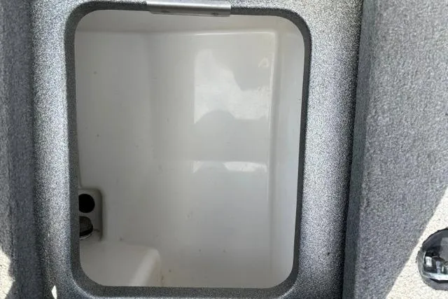 Slide: The Image of Storage compartment of 2021 Caymas CX 19 boat, featuring a clean, spacious interior. - 61
