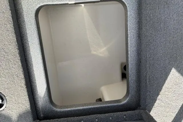 Slide: The Image of Storage compartment of 2021 Caymas CX 19 boat, featuring a clean, spacious interior. - 62