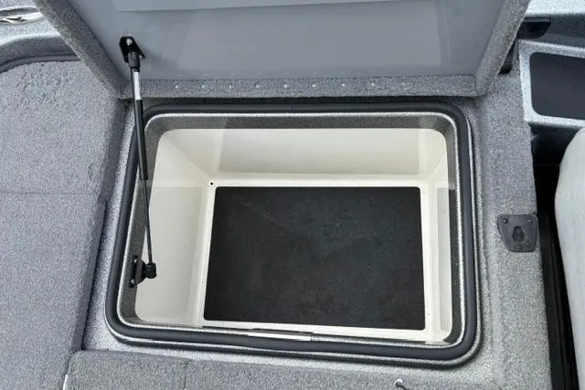 Slide: The Image of Open storage compartment in 2021 Caymas CX 19 boat, featuring a spacious interior. - 63