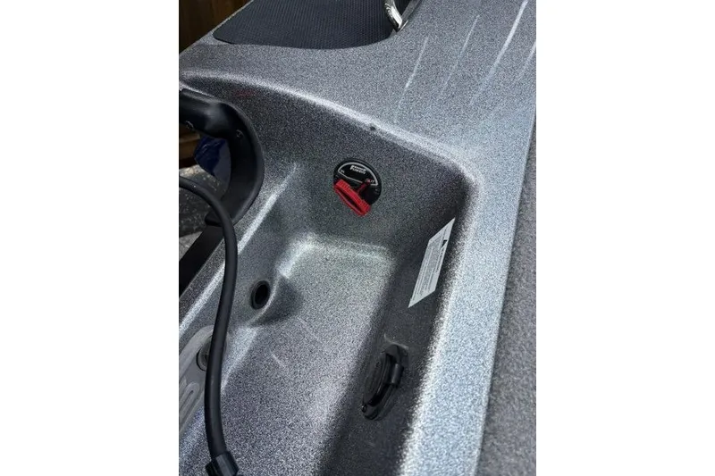 Slide: The Image of 2021 Caymas CX 19 boat interior detail with control panel and textured surface. - 66