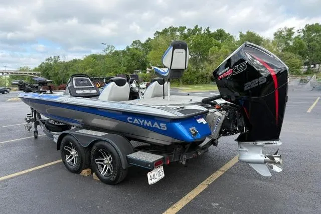 Slide: The Image of 2021 Caymas CX 19 boat with Mercury 225 engine in parking lot. - 9