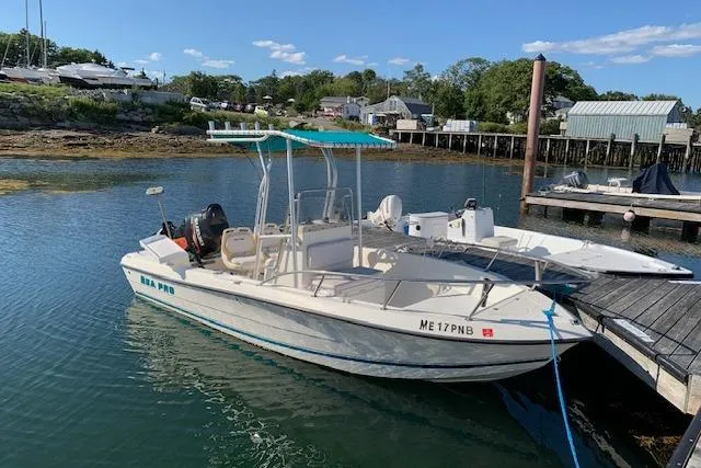 The Image of 2001 Sea Pro 190 Center Console boat docked in a scenic marina setting. - 0
