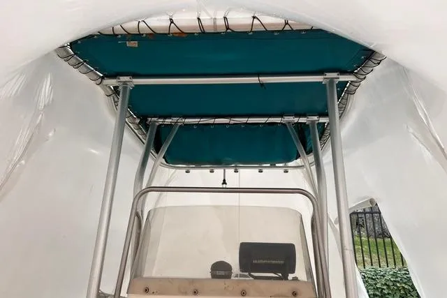 Slide: The Image of 2001 Sea Pro 190 Center Console boat with canopy, viewed from below. - 10