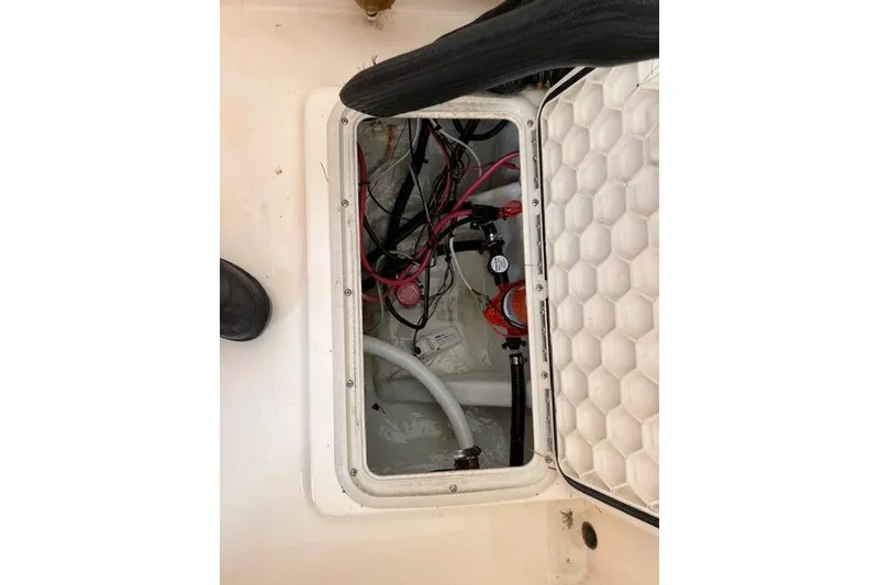 Slide: The Image of Open hatch of a 2001 Sea Pro 190 Center Console showing wiring and components. - 12
