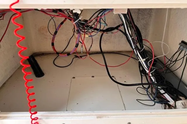 Slide: The Image of Wiring compartment of a 2001 Sea Pro 190 Center Console boat. - 13
