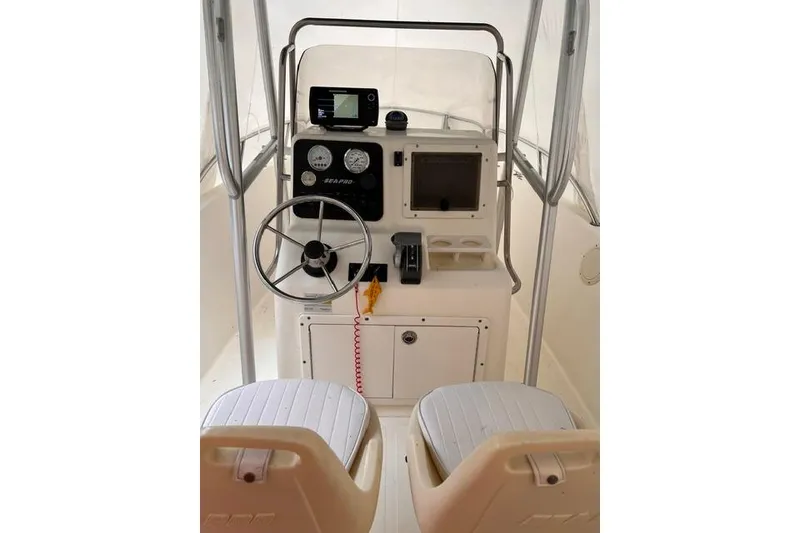 Slide: The Image of 2001 Sea Pro 190 Center Console boat interior with steering wheel and navigation controls. - 3