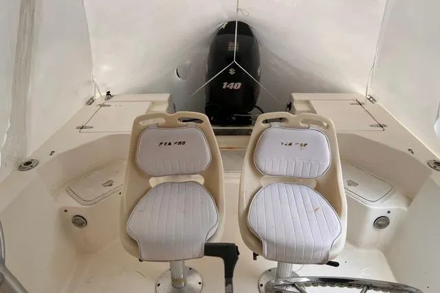 Slide: The Image of 2001 Sea Pro 190 Center Console boat interior with dual seats and Suzuki 140 outboard motor. - 4