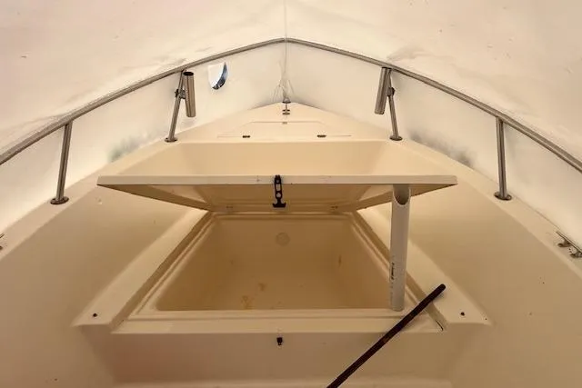 Slide: The Image of 2001 Sea Pro 190 Center Console boat interior with open storage compartment. - 6