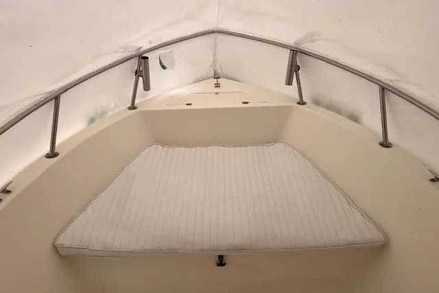 Slide: The Image of 2001 Sea Pro 190 Center Console boat interior with cushioned seating area. - 7