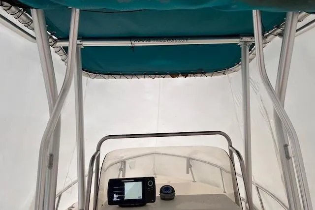 Slide: The Image of 2001 Sea Pro 190 Center Console boat interior with navigation equipment and canopy. - 9