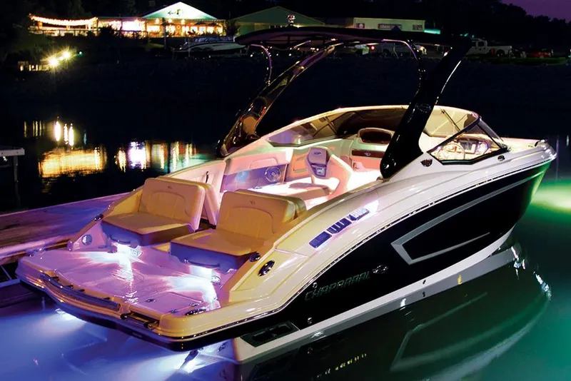 Slide: The Image of Manufacturer Provided Image: 2015 Chaparral 257 SSX boat illuminated at night, docked by the water. - 3