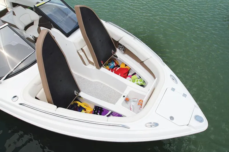 Slide: The Image of Manufacturer Provided Image: 2015 Chaparral 257 SSX boat with open storage compartments on the water. - 5