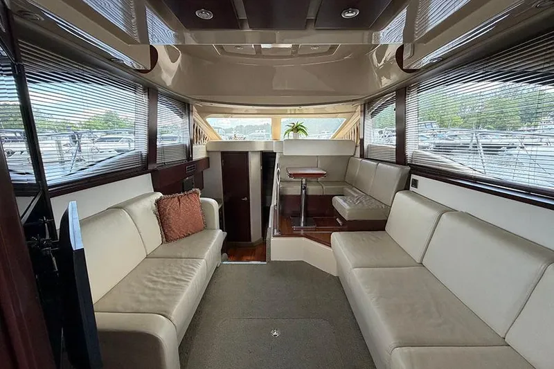 Slide: The Image of Luxurious interior of a 2008 Sea Ray 36 Sedan Bridge yacht with plush seating. - 13