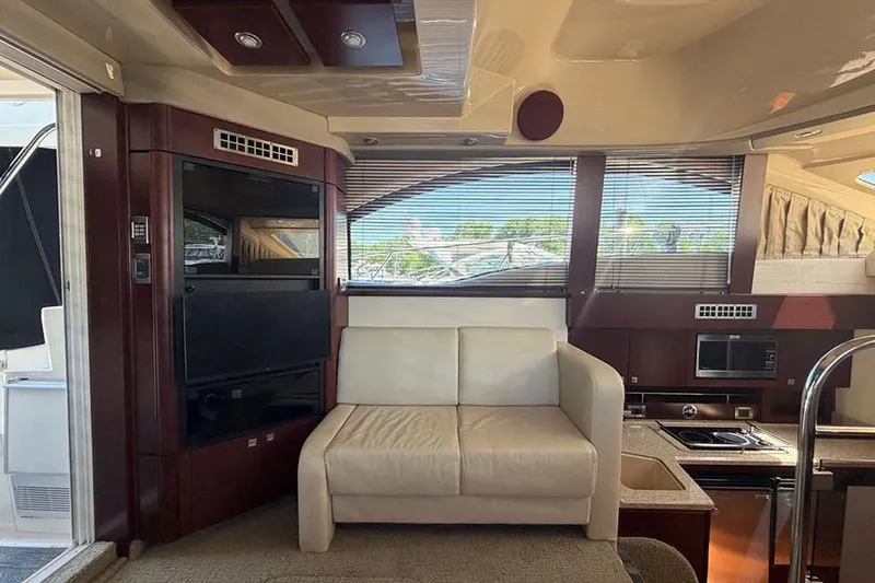 Slide: The Image of Interior of 2008 Sea Ray 36 Sedan Bridge yacht with leather seating and modern kitchen amenities. - 14