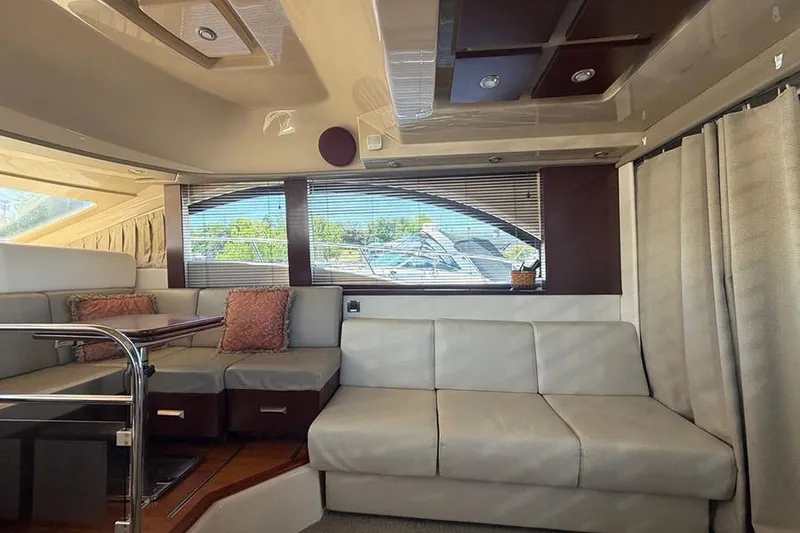 Slide: The Image of Interior of 2008 Sea Ray 36 Sedan Bridge yacht with modern seating and large windows. - 15