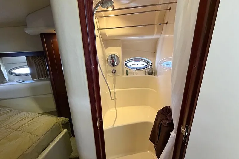 Slide: The Image of Bathroom interior of 2008 Sea Ray 36 Sedan Bridge yacht with shower and porthole windows. - 26
