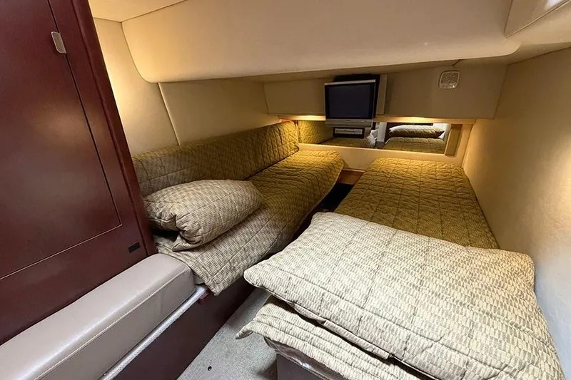 Slide: The Image of Interior cabin of 2008 Sea Ray 36 Sedan Bridge with twin beds and TV. - 30