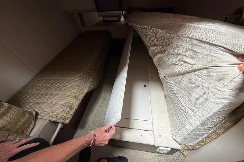 Slide: The Image of Interior view of 2008 Sea Ray 36 Sedan Bridge showing under-bed storage space. - 31